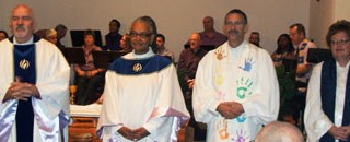 Rev. Mick Hinson (third from left) at his installation at MCC San Antonio in 2007. (Photo by Sam Sanchez)