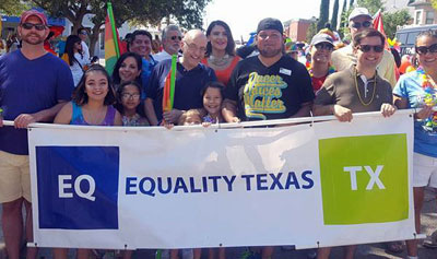 Robert Salcido (right of center in black t-shirt) with members of Equality Texas at the Austin Pride Parade. (Photo: Ignite Austin)